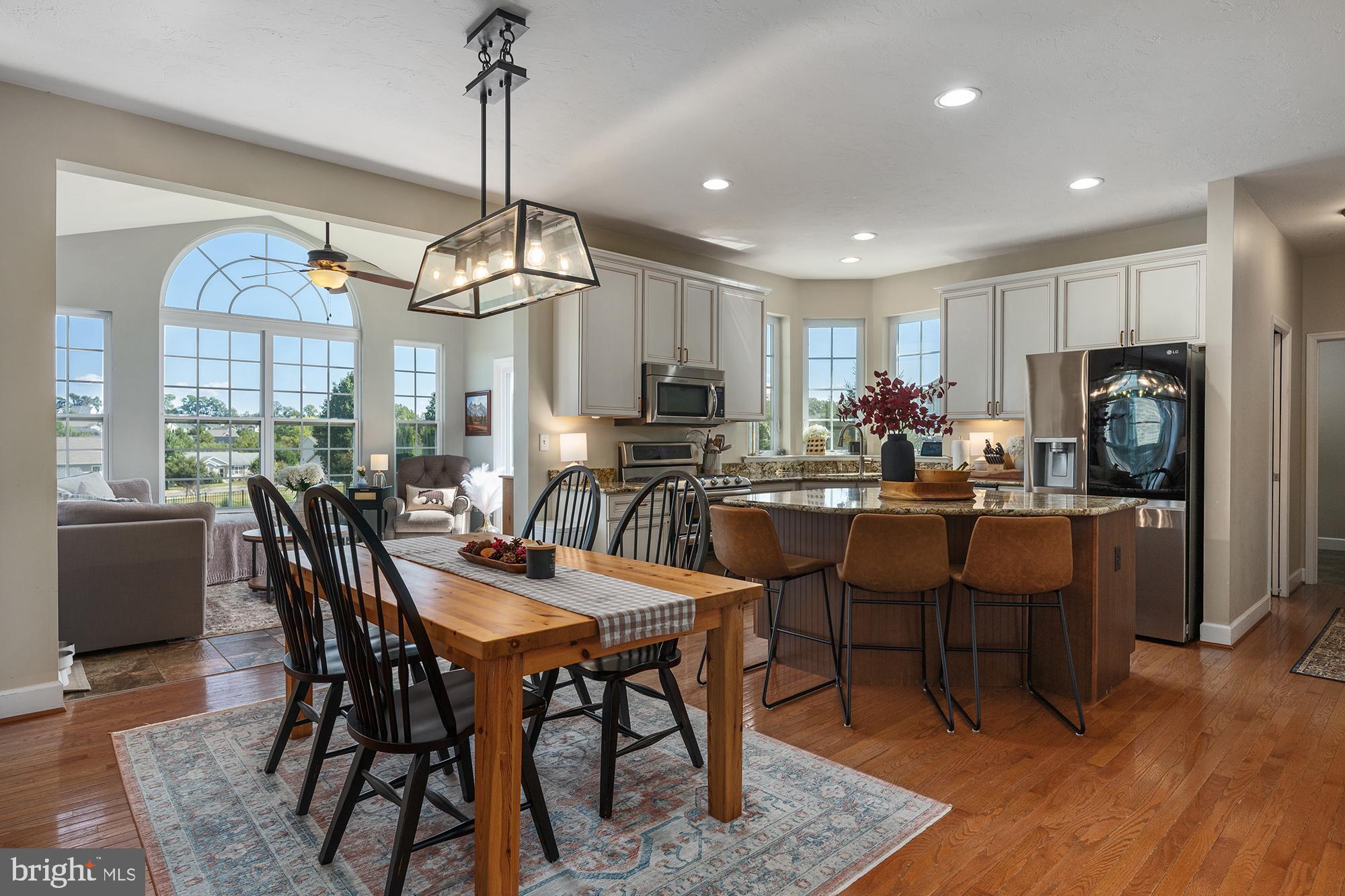 12 Boulder Road Hanover, PA 17331 - Photo 9 of 61 a room with stainless steel appliances kitchen island granite countertop a dining table chairs and a refrigerator