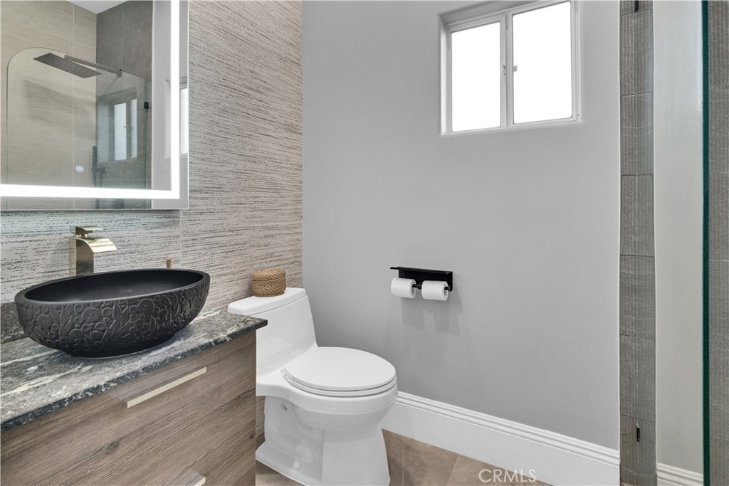 4295 Union Road Paso Robles, CA 93446 - Photo 11 of 27 a bathroom with a toilet a sink and a mirror