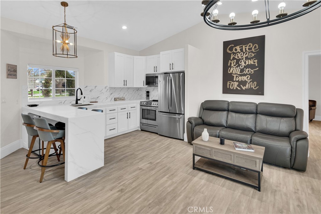 4295 Union Road Paso Robles, CA 93446 - Photo 14 of 27 a living room with furniture and a chandelier