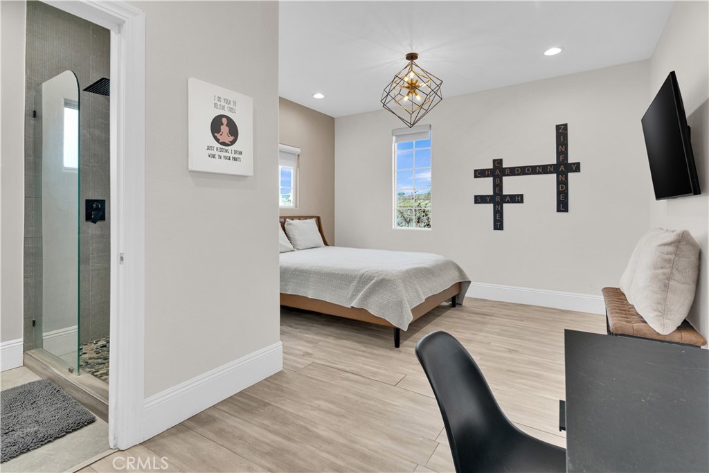 4295 Union Road Paso Robles, CA 93446 - Photo 9 of 27 a bedroom with a bed and a flat screen tv