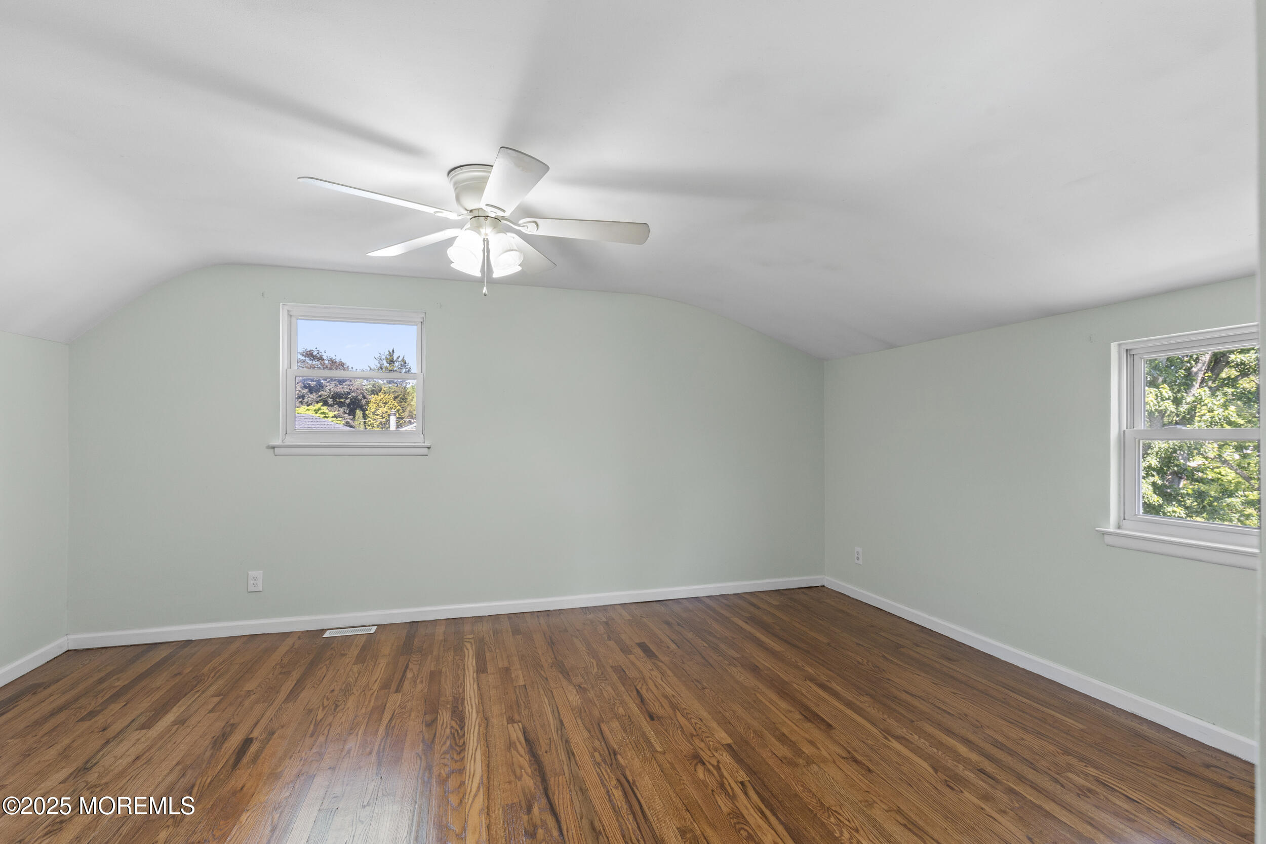 18 Hampton Road Howell, NJ 07731 - Photo 18 of 32 a view of a room with wooden floor and a ceiling fan