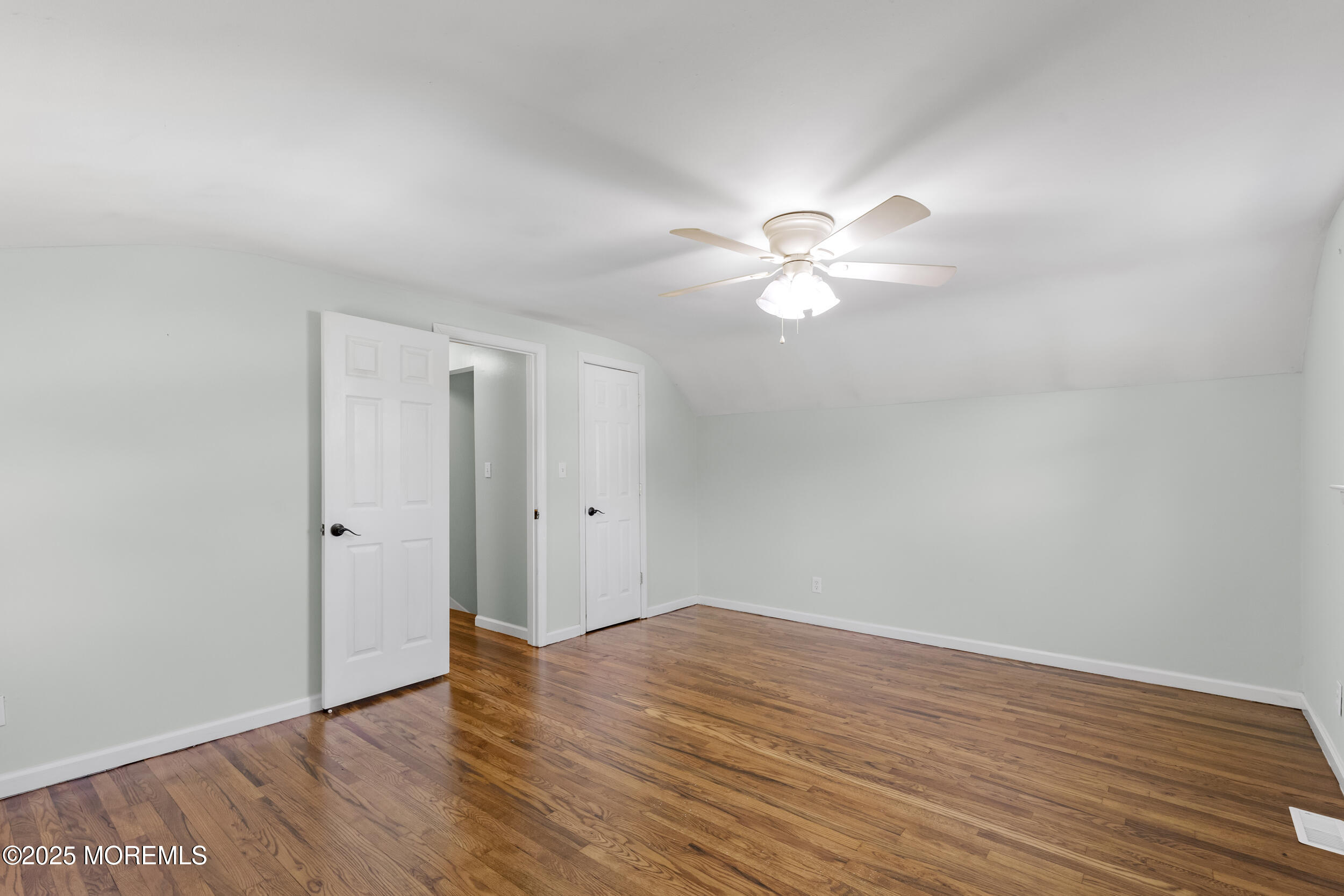 18 Hampton Road Howell, NJ 07731 - Photo 19 of 32 a view of an empty room with wooden floor