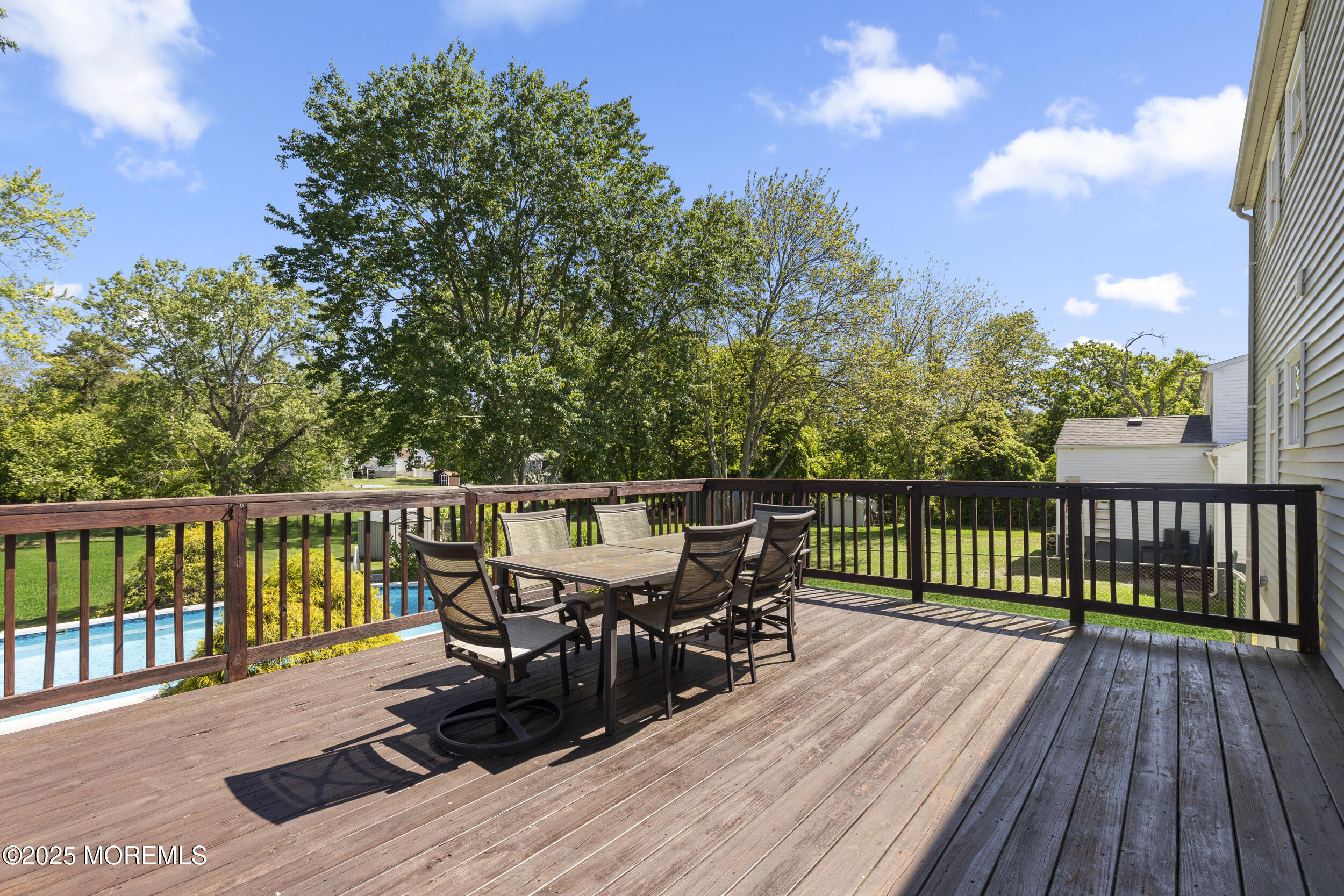 18 Hampton Road Howell, NJ 07731 - Photo 26 of 32 a view of a deck with two chairs and wooden floor