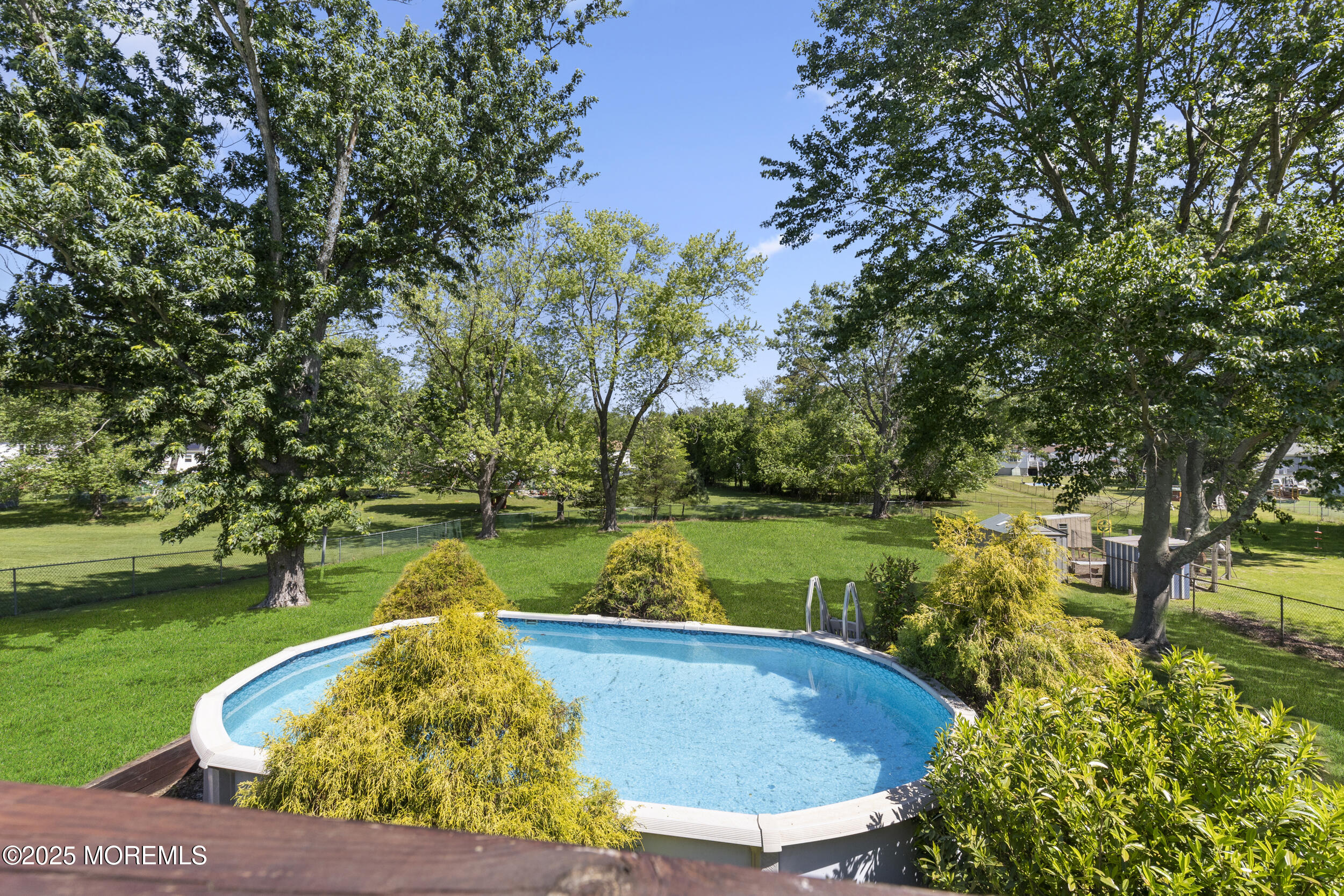 18 Hampton Road Howell, NJ 07731 - Photo 28 of 32 a view of a swimming pool with a lake view