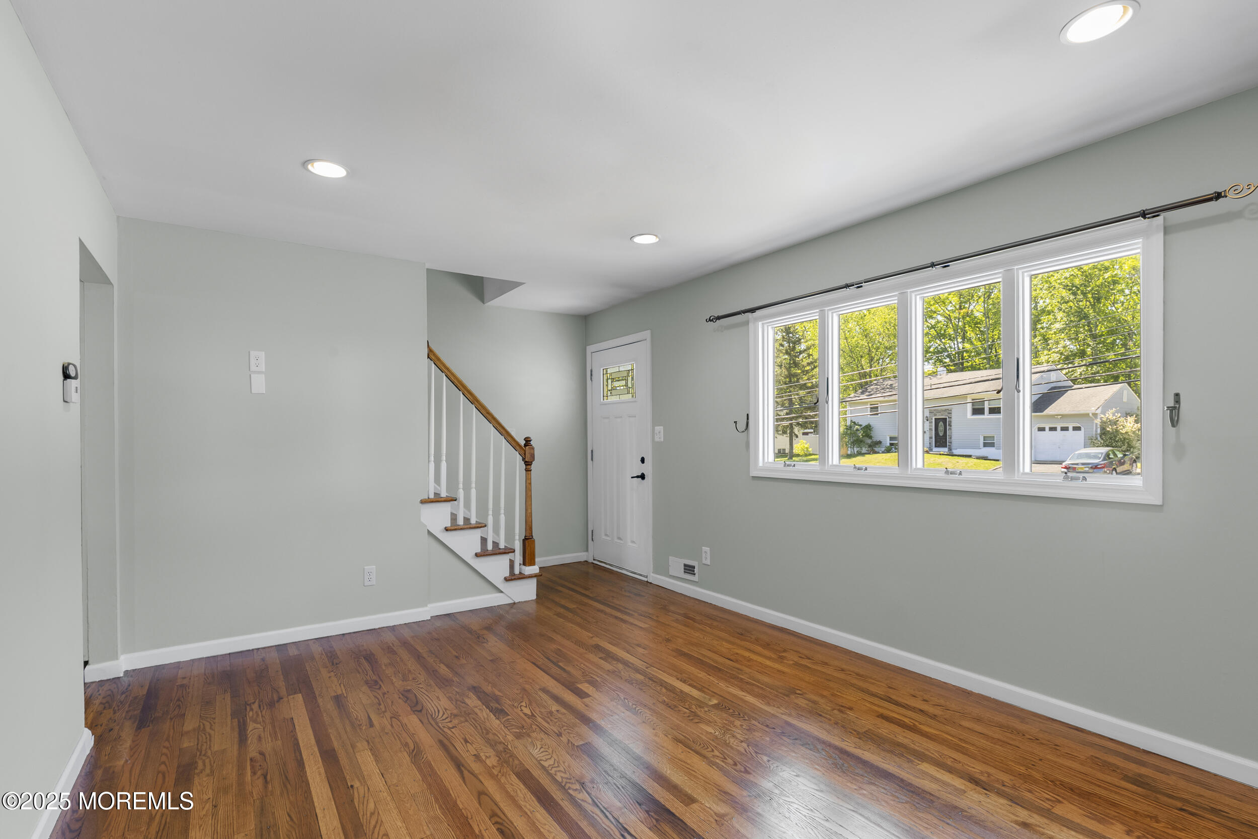 18 Hampton Road Howell, NJ 07731 - Photo 5 of 32 a view of room with window and wooden floor