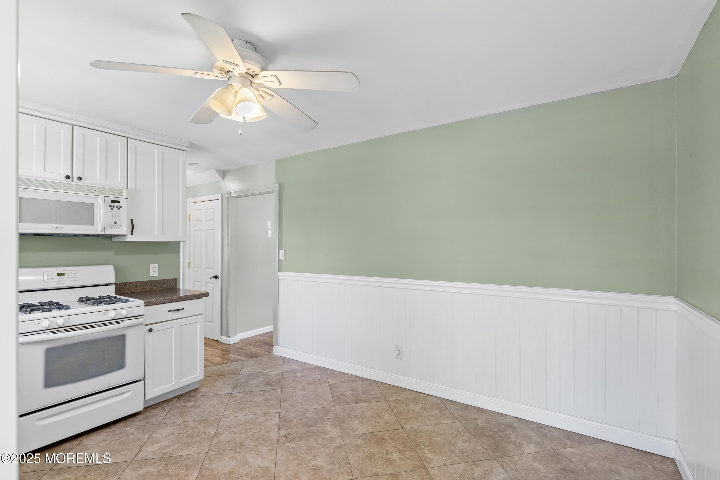 18 Hampton Road Howell, NJ 07731 - Photo 9 of 32 a kitchen with cabinets a sink and white stainless steel appliances