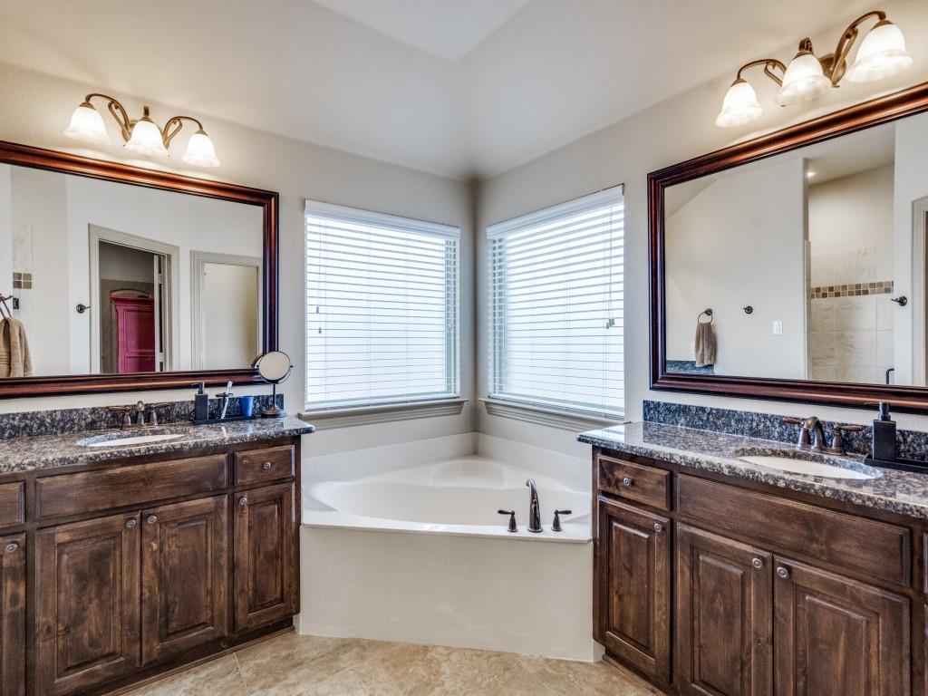 519 Gene Autry Lane Murphy, TX 75094 - Photo 15 of 25 Full bath with a garden tub, two vanities, and light tile patterned floors