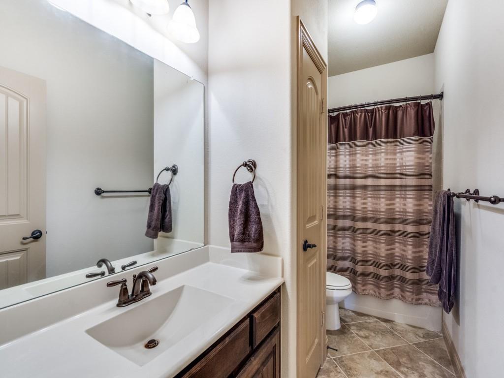 519 Gene Autry Lane Murphy, TX 75094 - Photo 20 of 25 Full bathroom with vanity, shower / tub combo, and light tile patterned floors