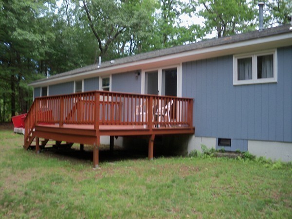 186 Ayer Road Shirley, MA 01464 - Photo 16 of 22 a view of a house with a backyard and sitting area