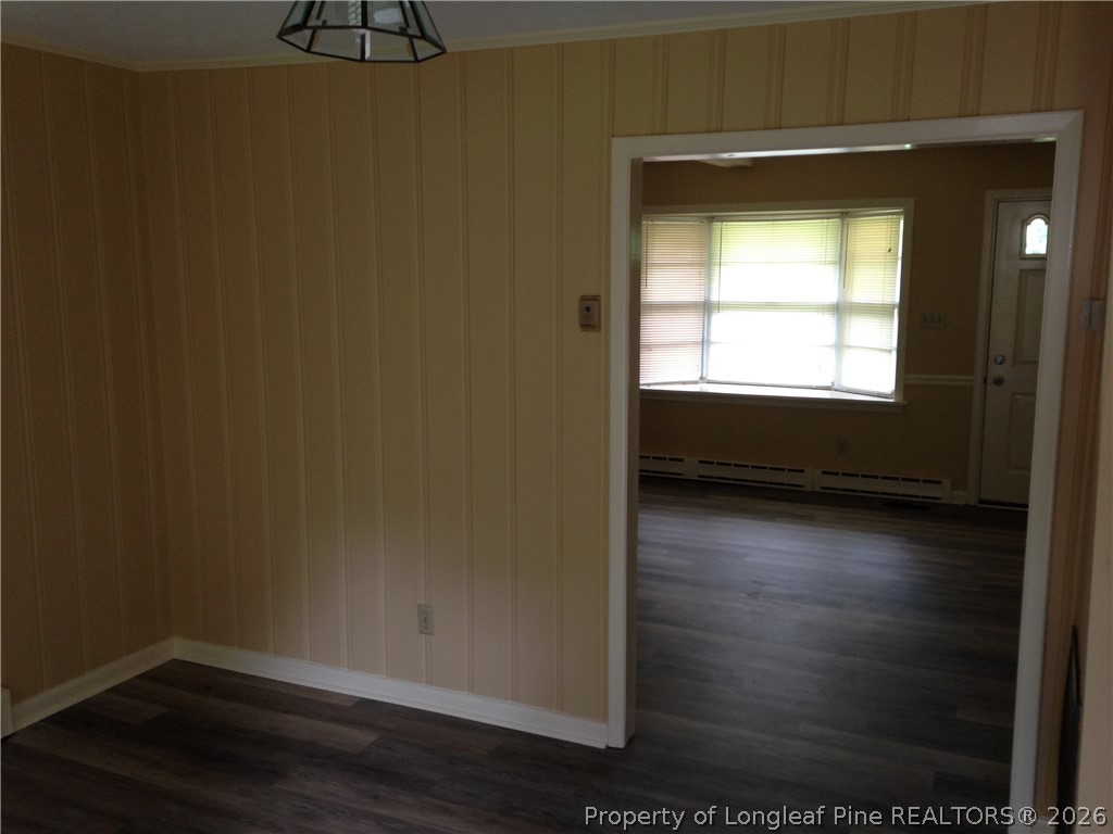 608 Bee Gee Road Lumberton, NC 28358 - Photo 2 of 8 a view of an empty room with wooden floor and a window