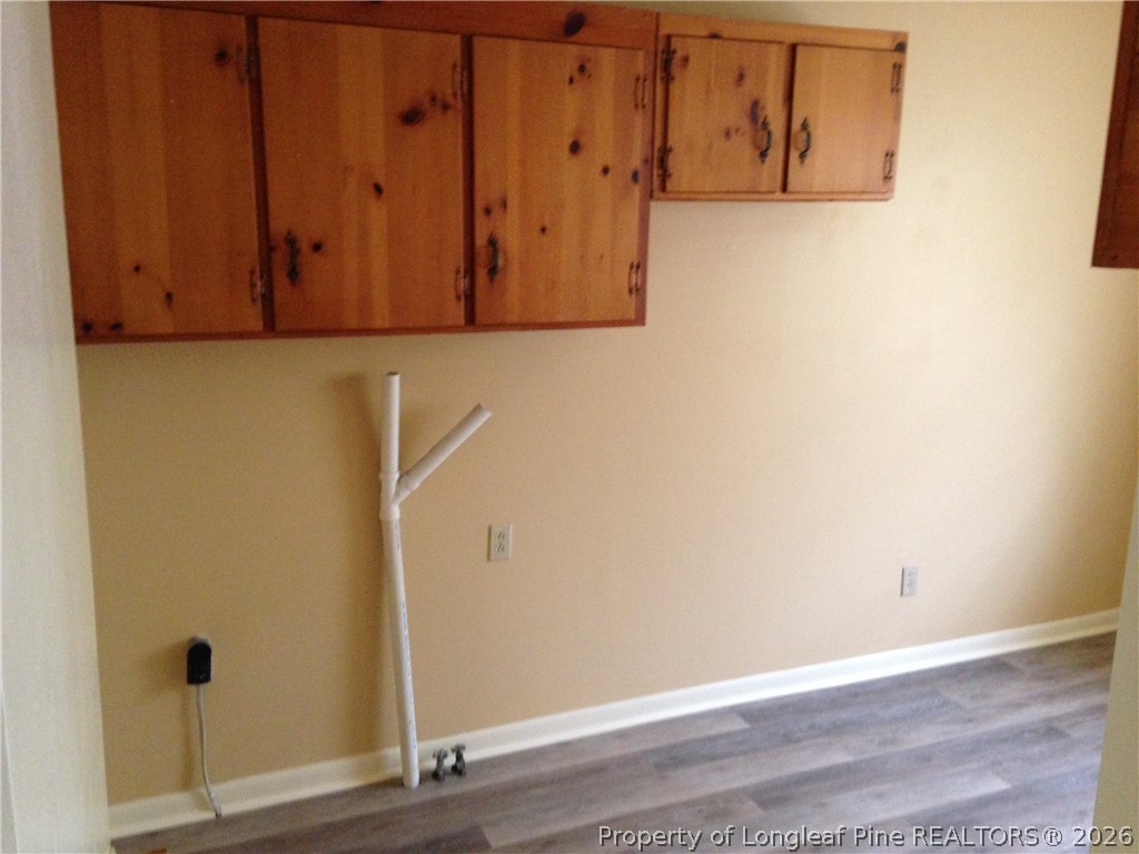 608 Bee Gee Road Lumberton, NC 28358 - Photo 5 of 8 an empty room with wooden floor