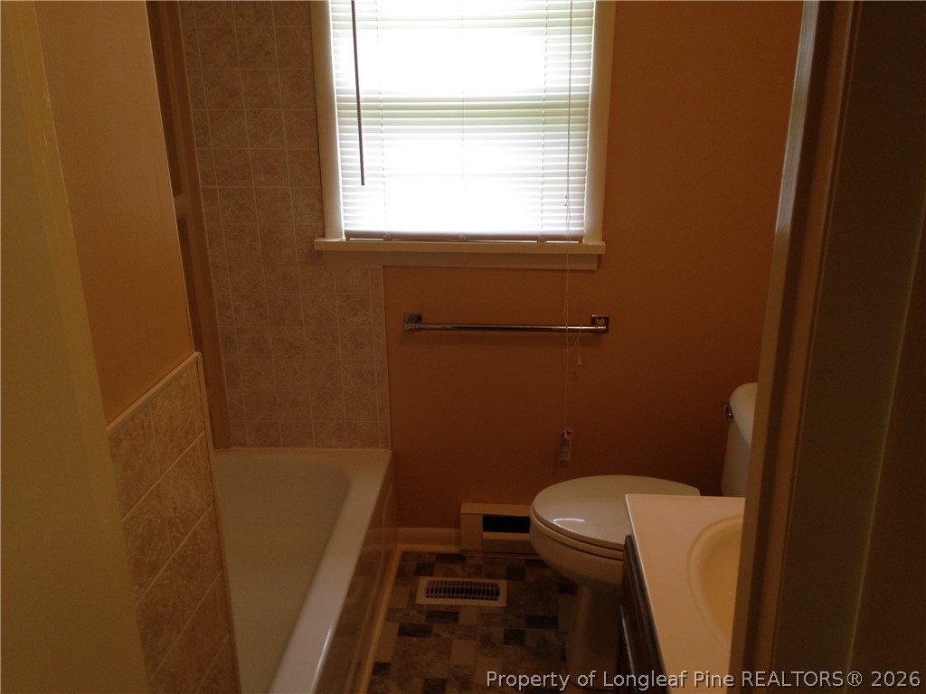 608 Bee Gee Road Lumberton, NC 28358 - Photo 6 of 8 a bathroom with a toilet and a sink
