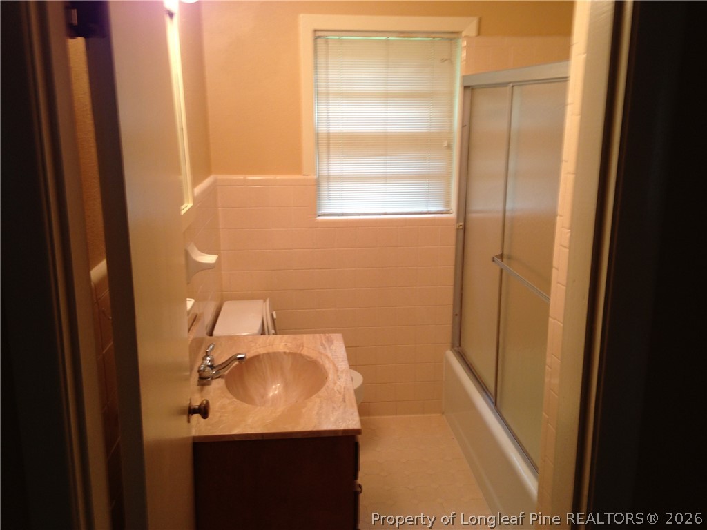 608 Bee Gee Road Lumberton, NC 28358 - Photo 7 of 8 a bathroom with a sink and a mirror