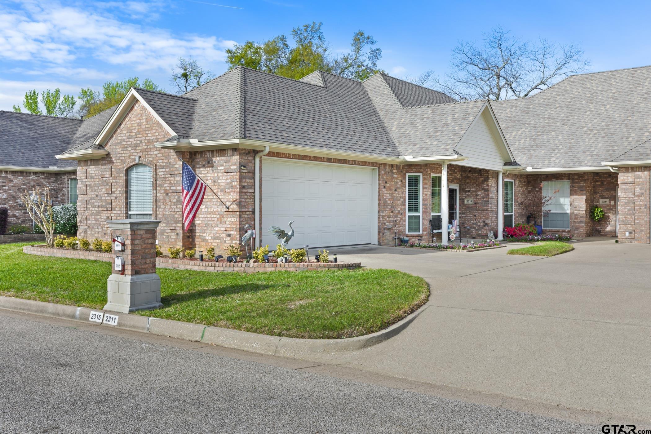 front view of a house with a yard