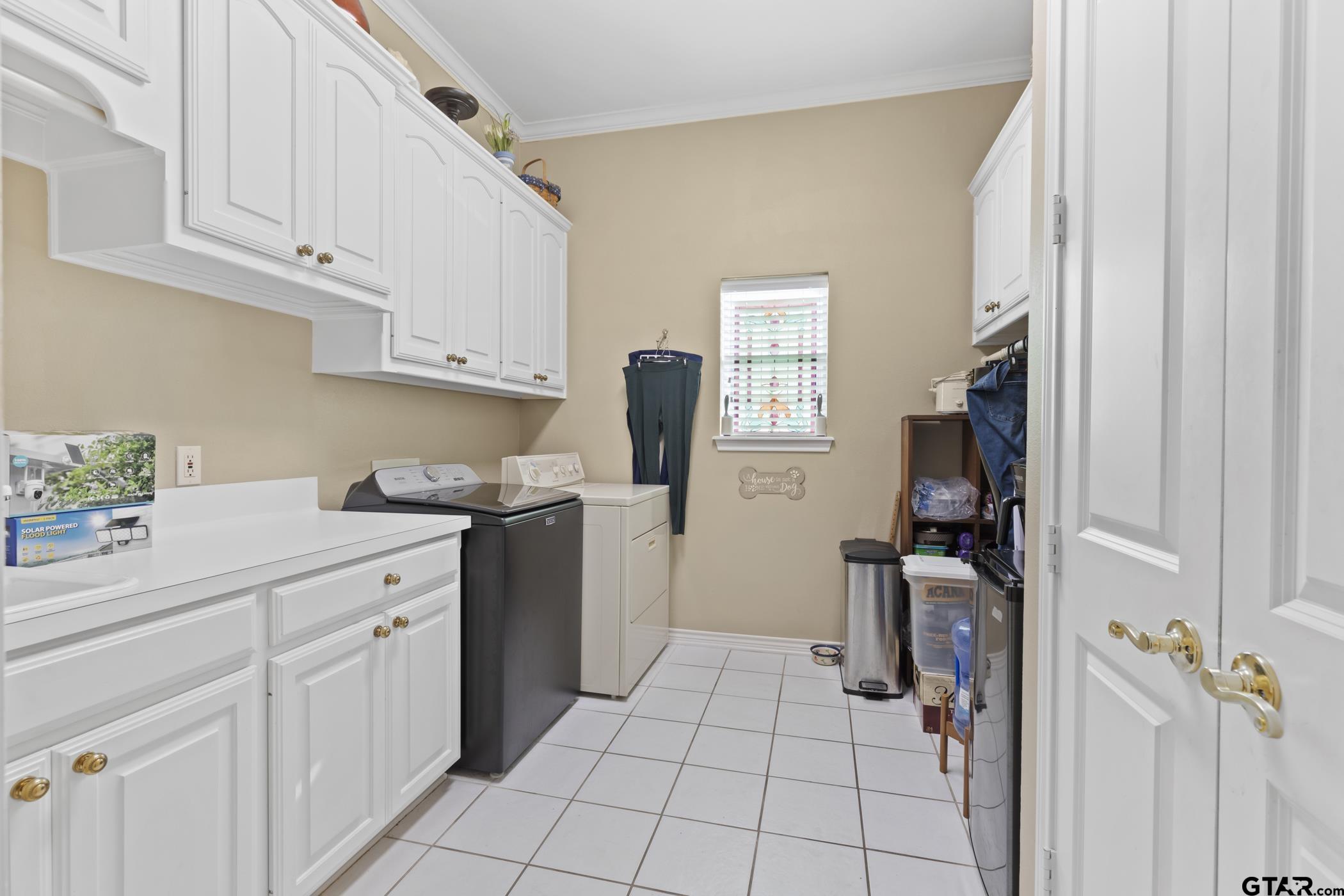 2315 Homestead Lane Tyler, TX 75701 - Photo 13 of 20 a kitchen with white cabinets and appliances