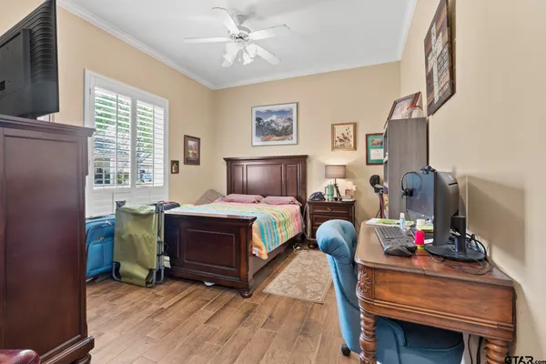 a bedroom with furniture and a window