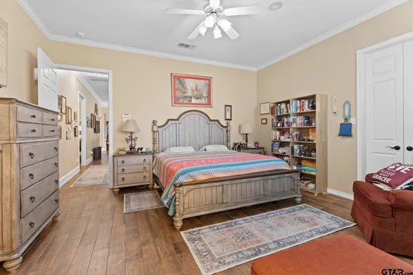 a bedroom with a bed furniture and decor