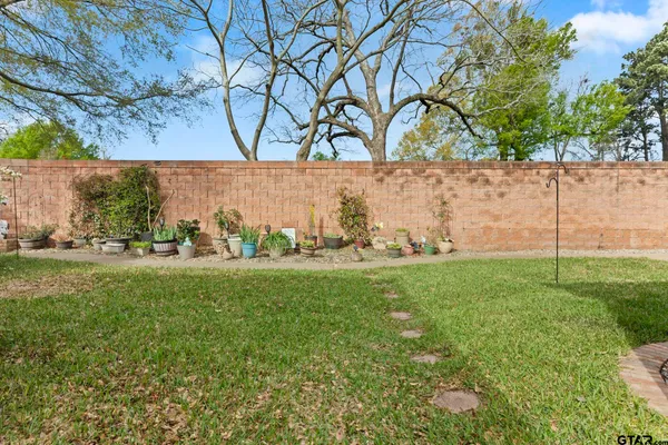 a view of a field with an outdoor space