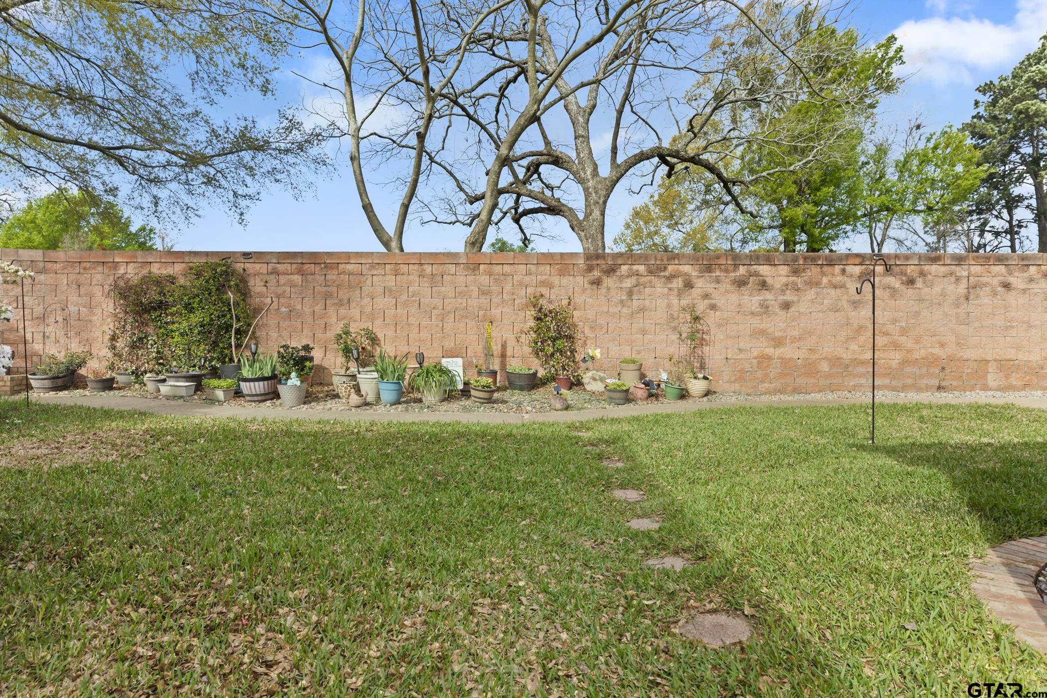 2315 Homestead Lane Tyler, TX 75701 - Photo 20 of 20 a view of a field with an outdoor space