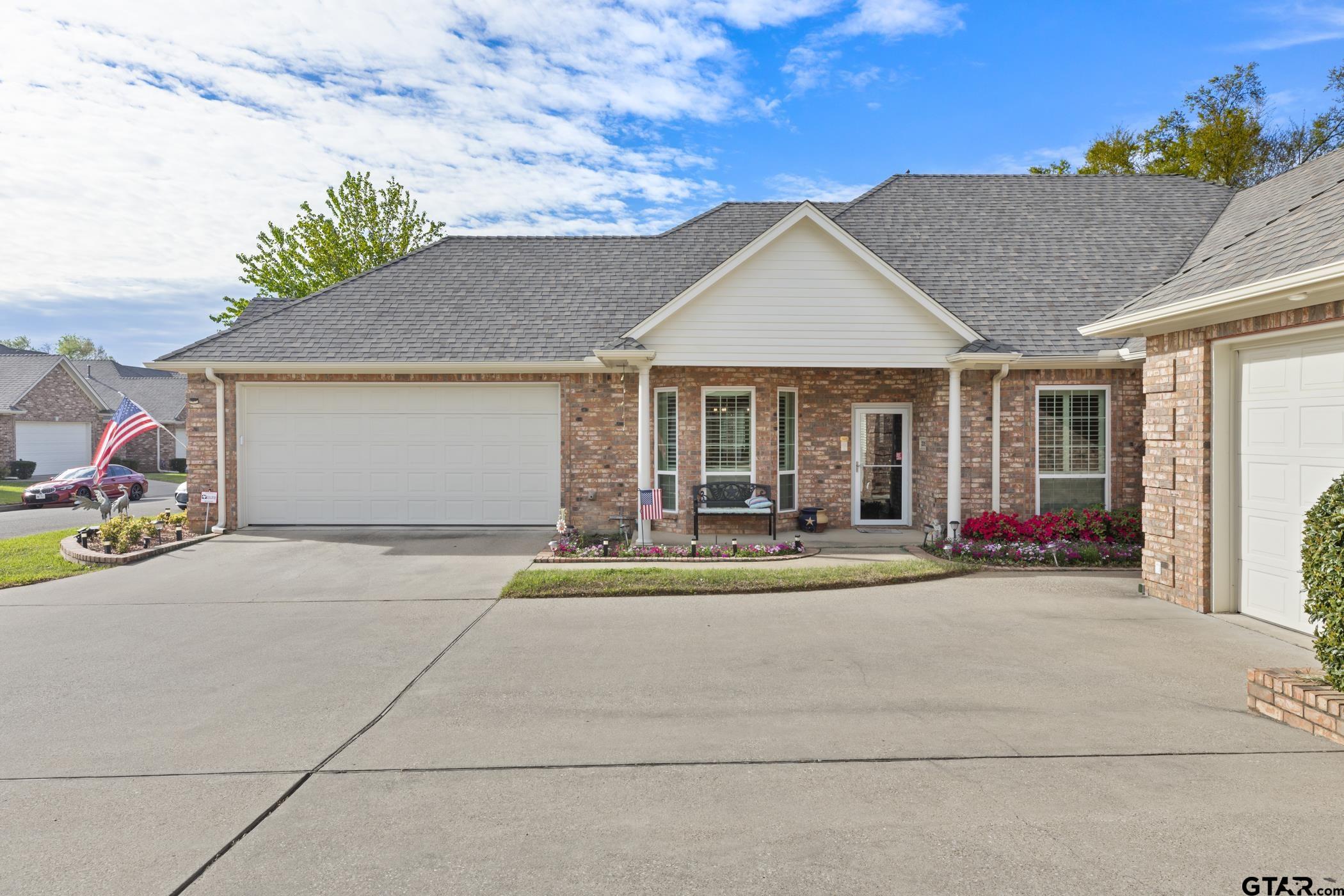 2315 Homestead Lane Tyler, TX 75701 - Photo 2 of 20 a white house with palm trees in the background