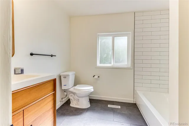 a view of a back yard from a room