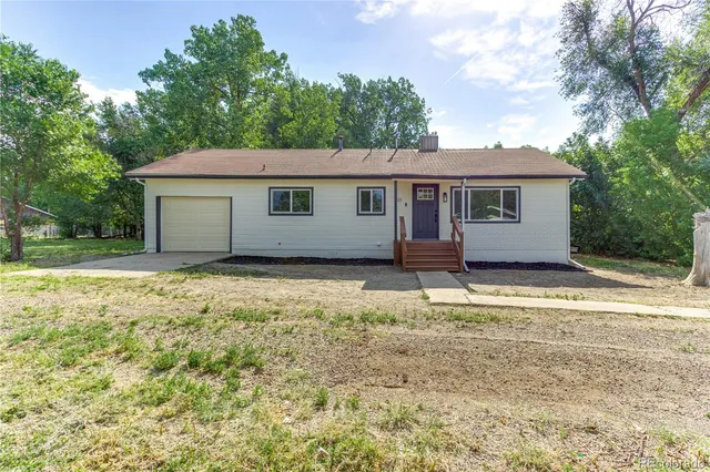 a house with trees in front of it