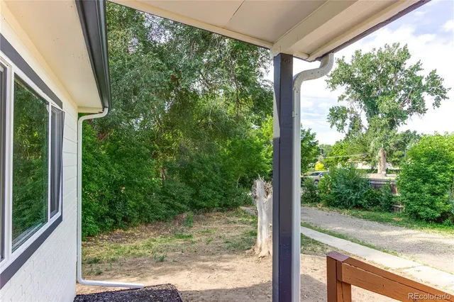 a view of a room with a large window and floor