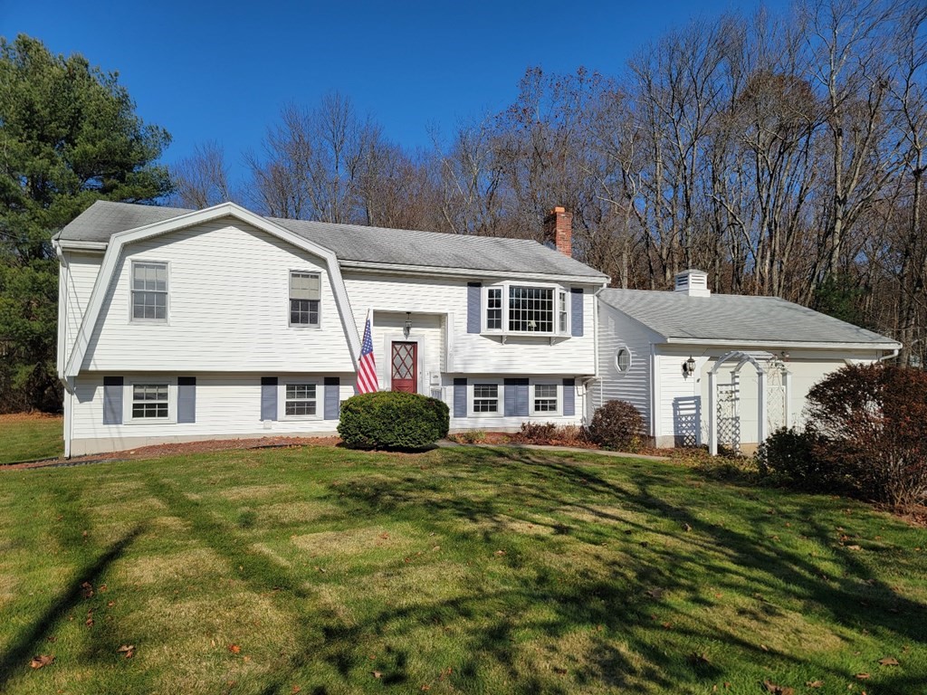 119 Cordaville Road Ashland, MA 01721 - Photo 1 of 32 a front view of a house with a garden