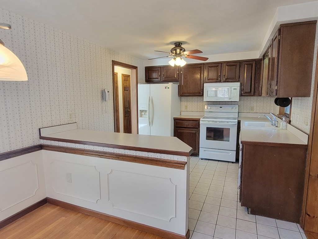 119 Cordaville Road Ashland, MA 01721 - Photo 11 of 32 a kitchen with cabinets and stainless steel appliances