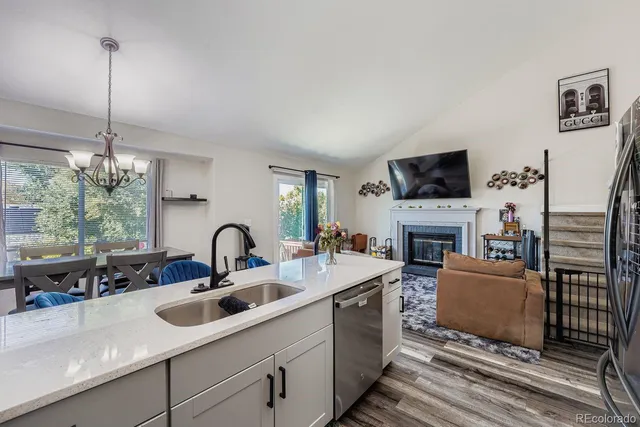 a kitchen with a refrigerator and a sink
