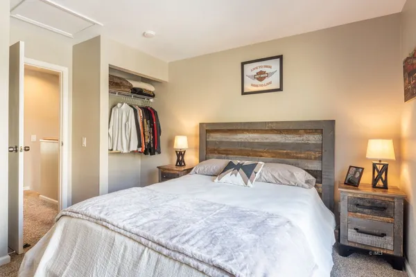 a bedroom with a bed and a view of bathroom