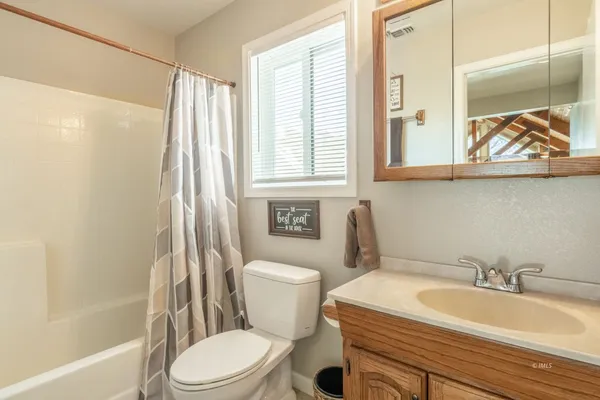 a bathroom with a sink a toilet and a bathtub