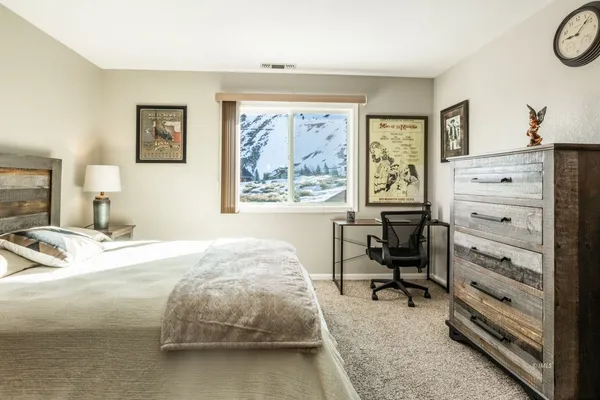 a bedroom with a bed and furniture