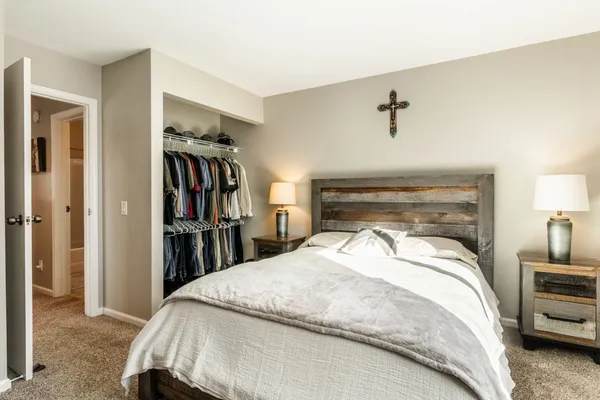 a bedroom with a bed and a walk in closet