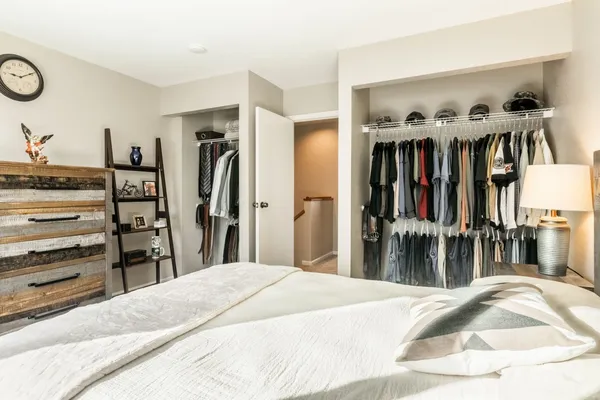 a bedroom with a bed and a view of bedroom