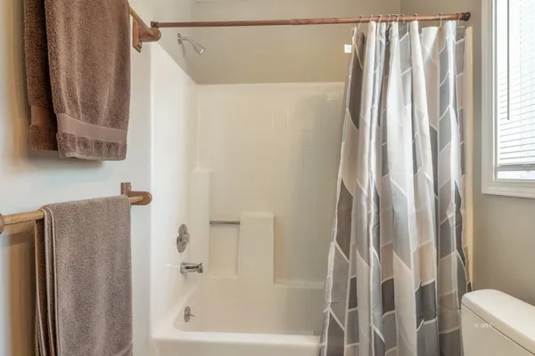 a bathroom with a shower and a tub