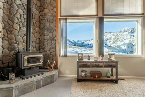 a room with a fireplace and a window