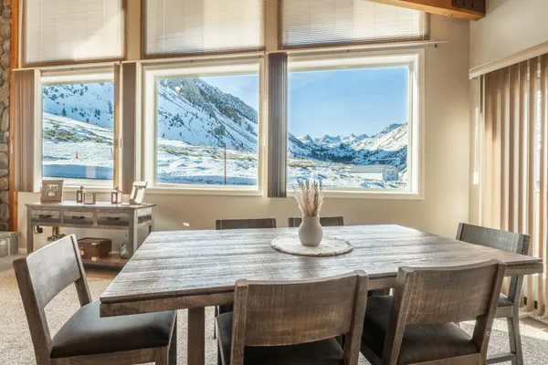 a dining room with furniture and window
