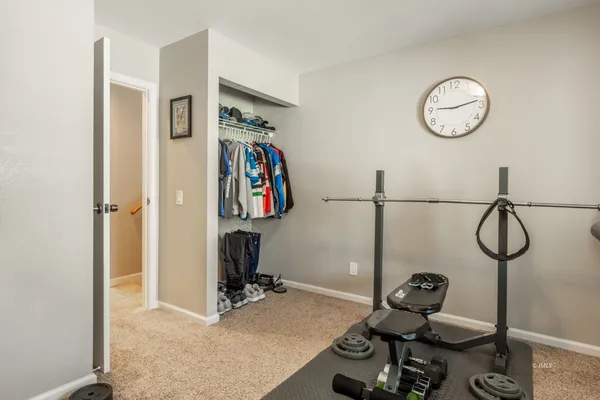 a view of storage and utility room with rack on the wall