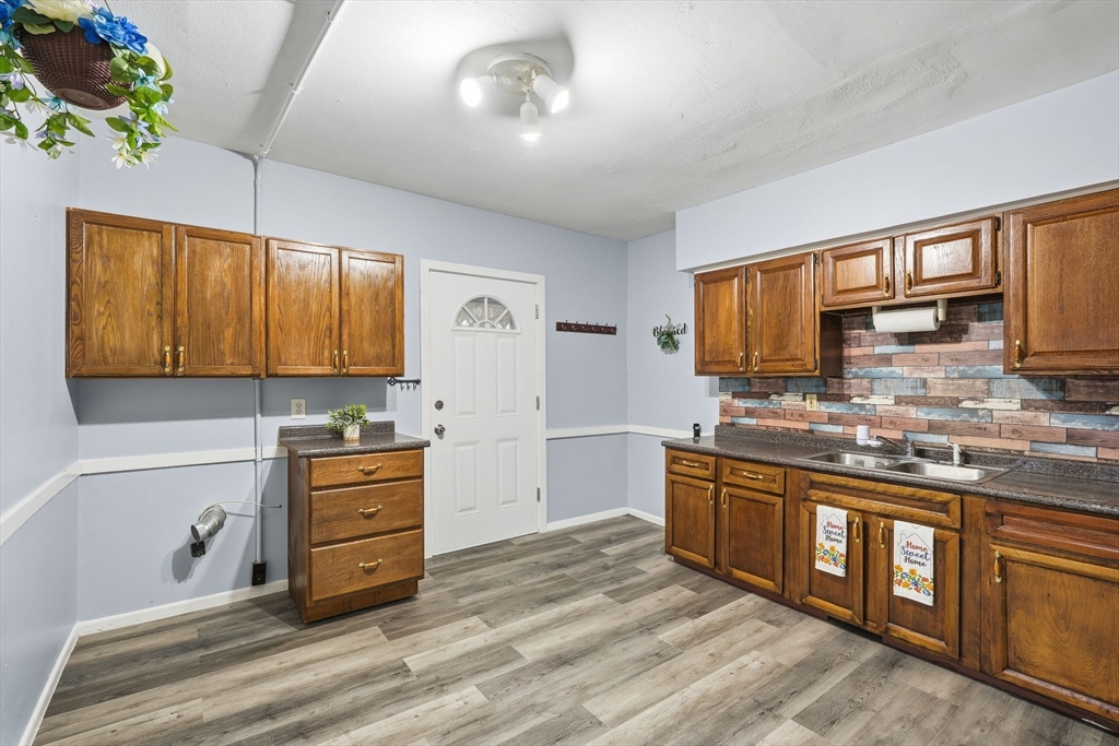 50-52 Maynard Street Springfield, MA 01109 - Photo 11 of 33 a kitchen with stainless steel appliances a sink stove and cabinets