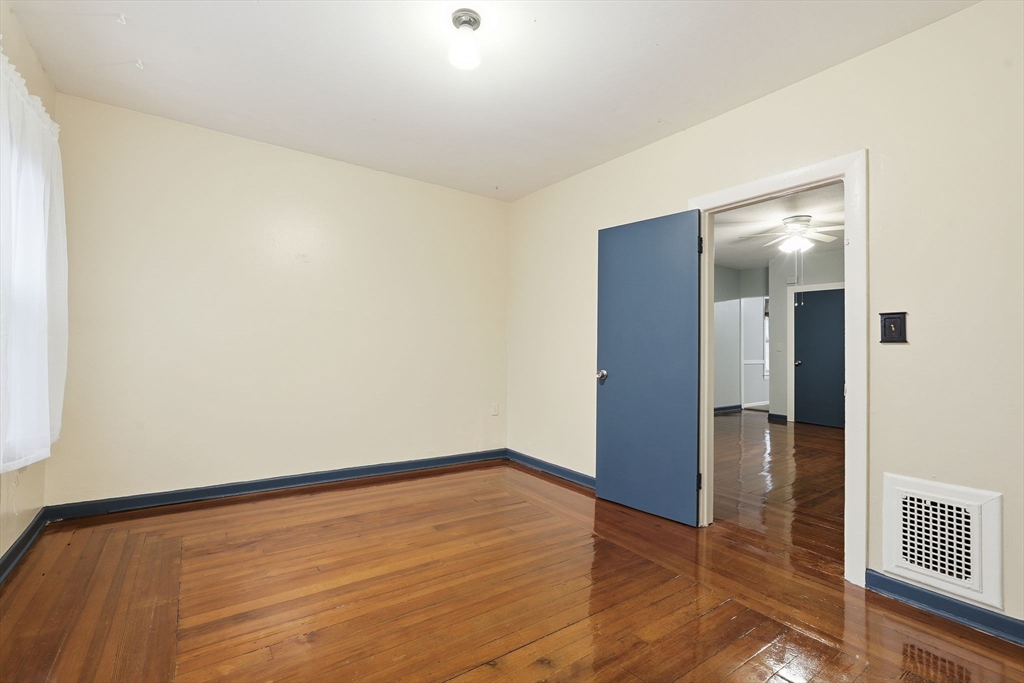 50-52 Maynard Street Springfield, MA 01109 - Photo 13 of 33 a view of empty room with wooden floor