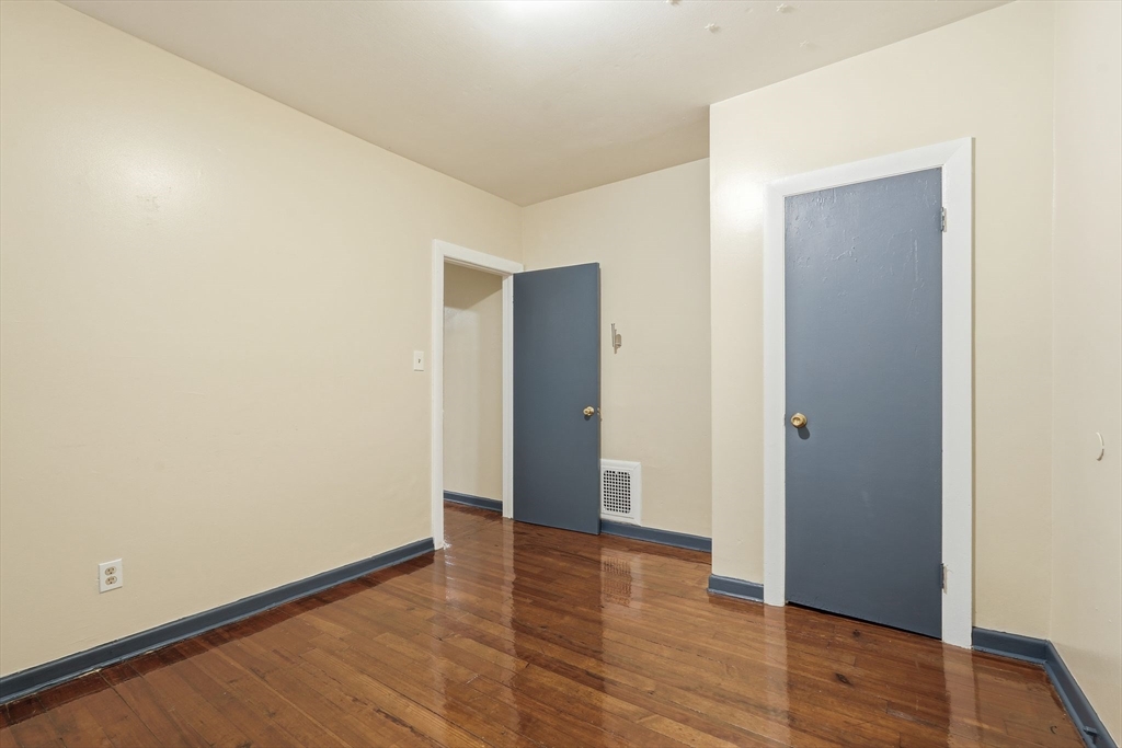50-52 Maynard Street Springfield, MA 01109 - Photo 18 of 33 a view of an empty room with wooden floor