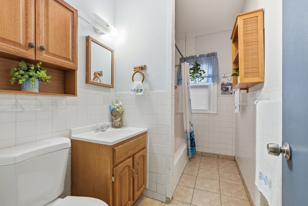50-52 Maynard Street Springfield, MA 01109 - Photo 19 of 33 a bathroom with a sink a toilet and shower