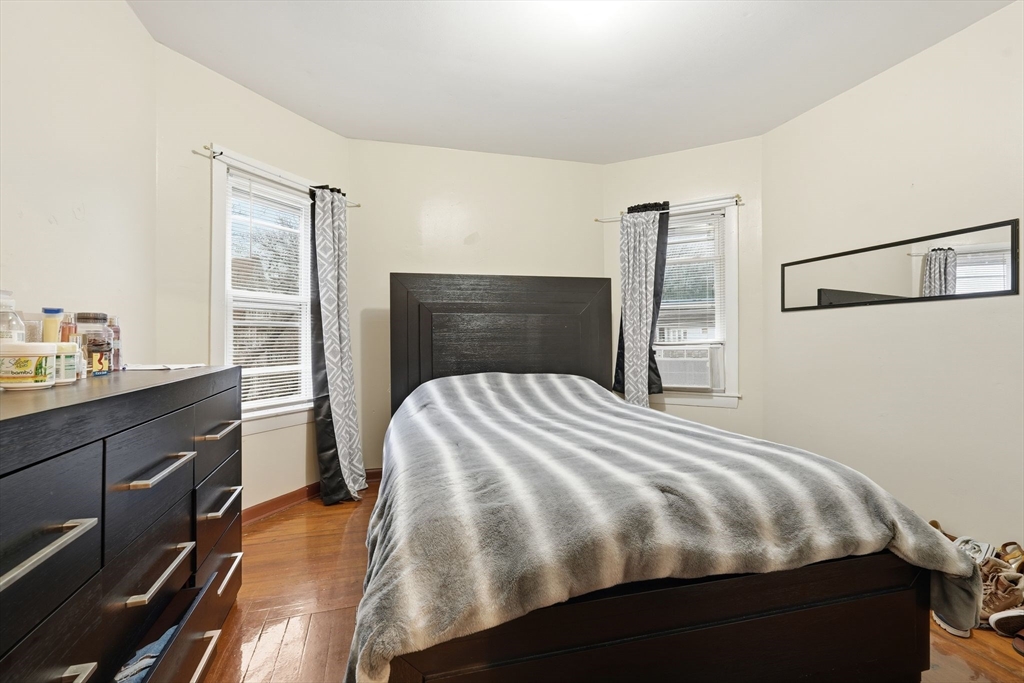 50-52 Maynard Street Springfield, MA 01109 - Photo 26 of 33 a bedroom with a bed and a dresser