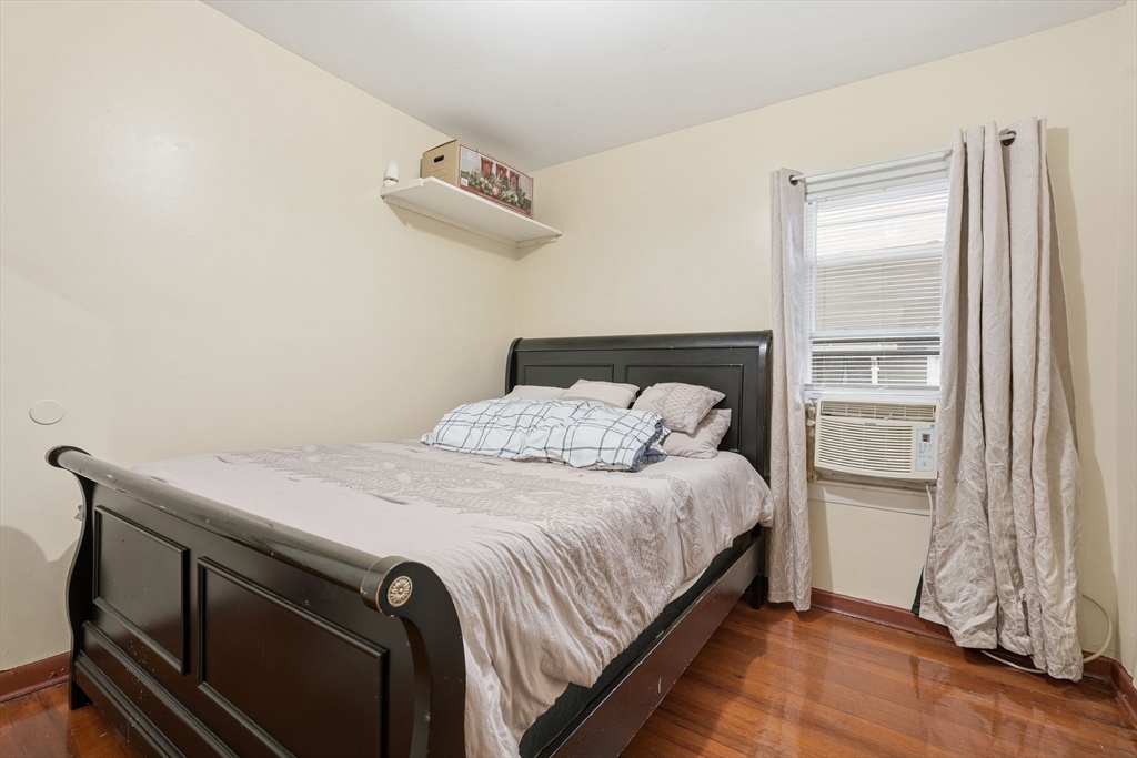 50-52 Maynard Street Springfield, MA 01109 - Photo 27 of 33 a bedroom with a bed and a window