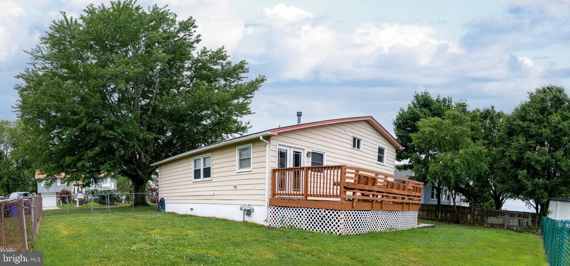 174 Kansas Road Pennsville, NJ 08070 - Photo 5 of 22 a view of a house with a yard