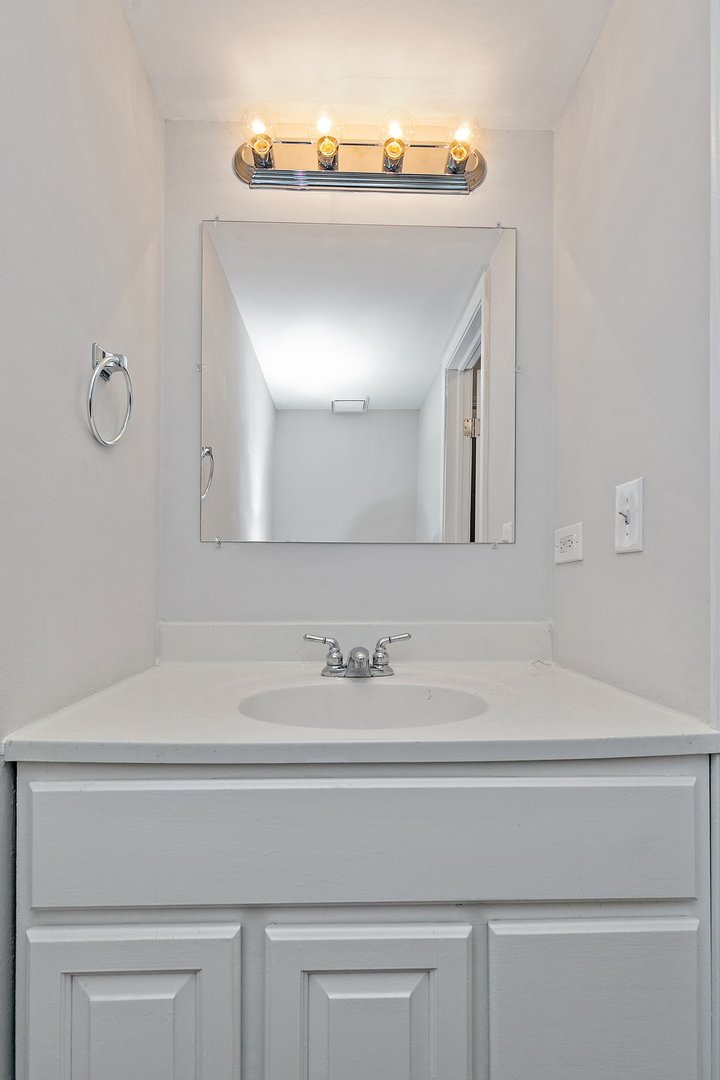 240 Penny Lane Bolingbrook, IL 60440 - Photo 14 of 22 a bathroom with a sink and a mirror