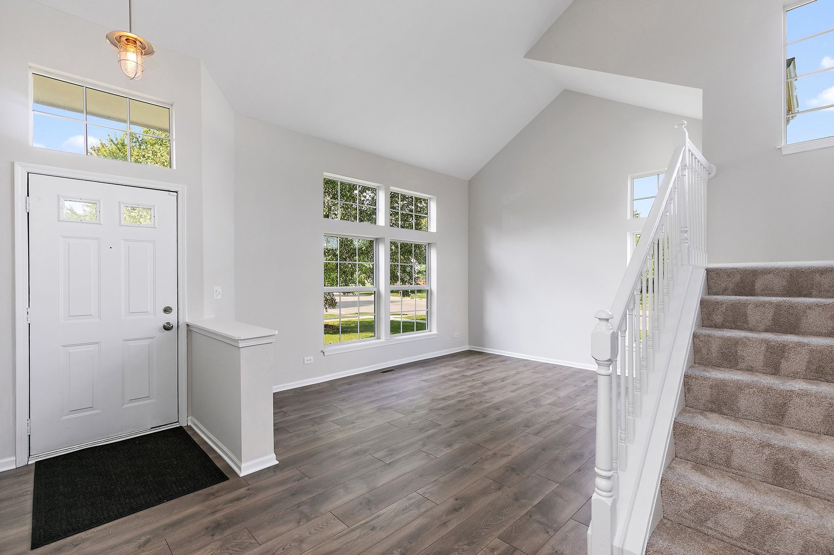240 Penny Lane Bolingbrook, IL 60440 - Photo 2 of 22 wooden floor in an empty room with a window