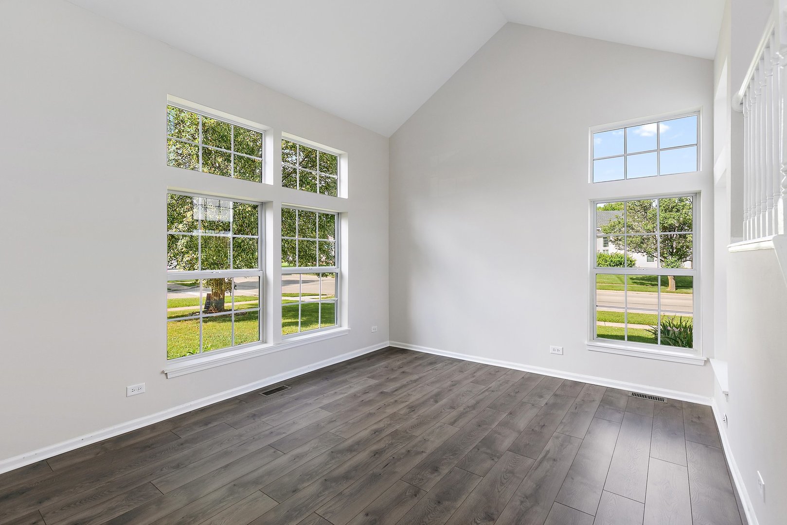 240 Penny Lane Bolingbrook, IL 60440 - Photo 3 of 22 an empty room with wooden floor and windows