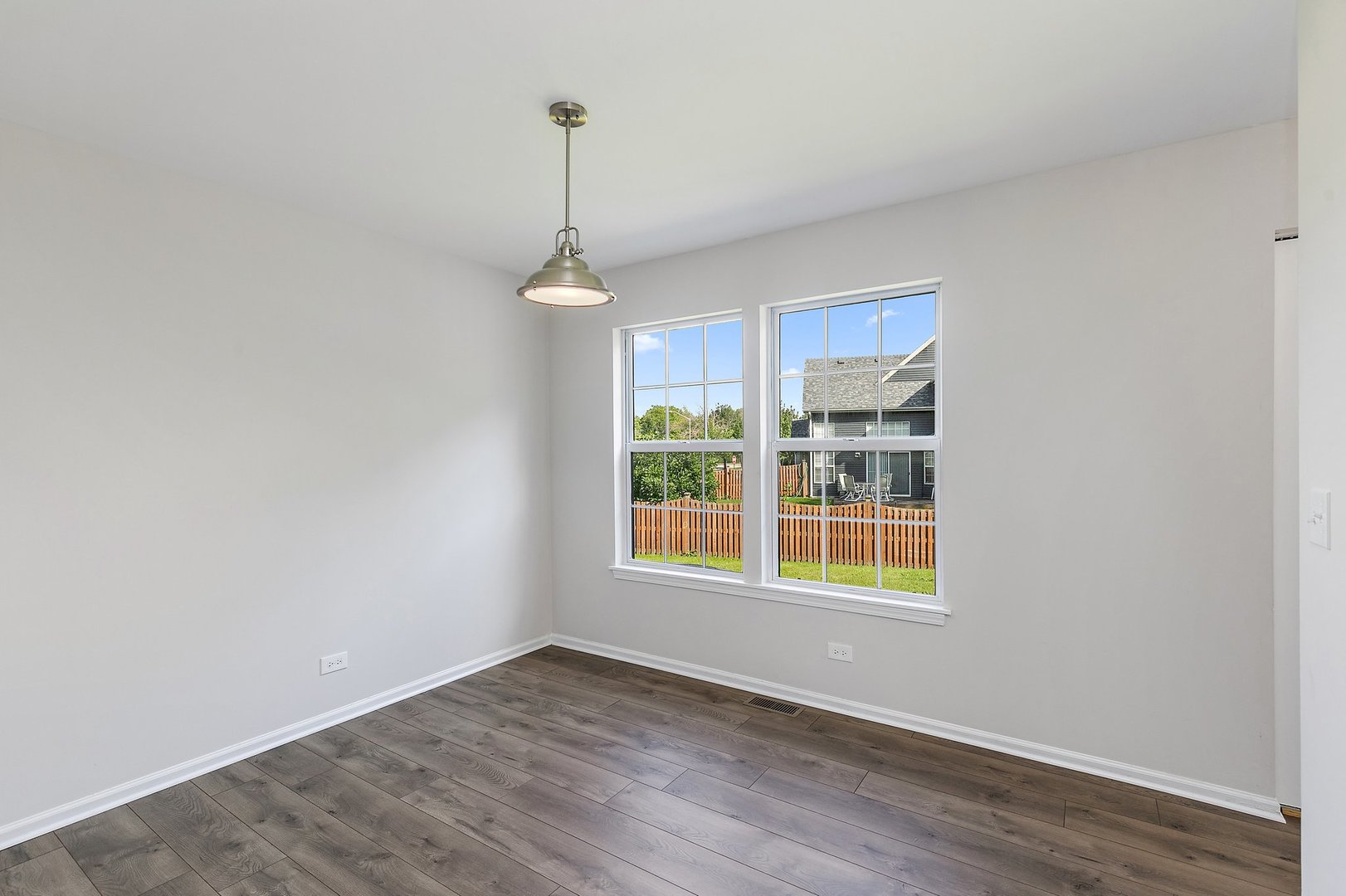 240 Penny Lane Bolingbrook, IL 60440 - Photo 6 of 22 a view of an empty room with windows